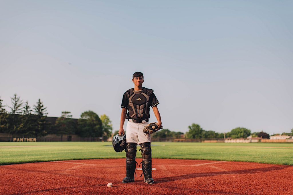 Senior photo of baseball player on baseball field