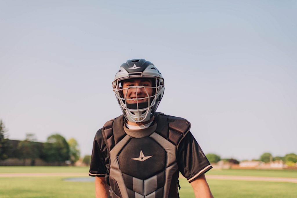 Senior photo of baseball player in catchers outfit