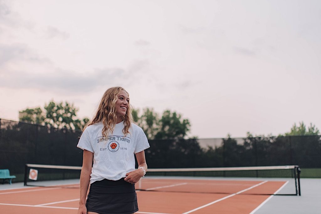 Senior photo taken at Wheaton Warrenville South tennis court